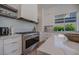 Modern kitchen featuring quartz countertops, stainless steel appliances, and custom cabinetry at 2797 Turtle Head Peak Dr, Las Vegas, NV 89135