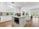 Bright, modern kitchen features a center island, stainless oven, wood floors and plenty of cabinet space at 2797 Turtle Head Peak Dr, Las Vegas, NV 89135