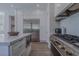 Modern kitchen featuring stainless steel appliances, a large island, and ample counter space for cooking at 2797 Turtle Head Peak Dr, Las Vegas, NV 89135