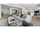 Bright living room with modern furnishings, hardwood floors, and an open layout, ideal for entertaining and relaxation at 2797 Turtle Head Peak Dr, Las Vegas, NV 89135