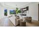 Bright living room features a cozy fireplace, stylish decor, and scenic views through the large window at 2797 Turtle Head Peak Dr, Las Vegas, NV 89135