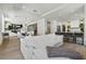 Open-concept living area with hardwood floors, modern lighting, and views into the kitchen at 2797 Turtle Head Peak Dr, Las Vegas, NV 89135