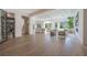 Spacious living area with wood floors, modern furnishings, and ample natural light creating an inviting atmosphere at 2797 Turtle Head Peak Dr, Las Vegas, NV 89135