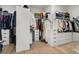 Spacious walk-in closet featuring custom shelving, drawers, and ample storage for clothing and accessories at 2797 Turtle Head Peak Dr, Las Vegas, NV 89135