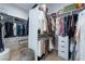 Well-organized walk-in closet with ample hanging and shelving space, plus functional drawers for folded items at 2797 Turtle Head Peak Dr, Las Vegas, NV 89135