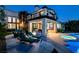 Beautiful backyard oasis with a pool, lounge chairs, patio furniture, and outdoor cooking area at 2837 Turtle Head Peak Dr, Las Vegas, NV 89135