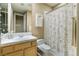 Bathroom with white tiled counter, sink and shower with floral designed shower curtain at 2837 Turtle Head Peak Dr, Las Vegas, NV 89135