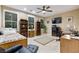 Cozy bedroom that doubles as a home office, with large windows and bookshelves at 2837 Turtle Head Peak Dr, Las Vegas, NV 89135