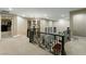 Wide view of the foyer featuring a chandelier, dark wood railings, and an open layout to the lower level at 2837 Turtle Head Peak Dr, Las Vegas, NV 89135