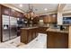 Well-equipped kitchen boasting stainless steel appliances, custom cabinets, and granite countertops at 2837 Turtle Head Peak Dr, Las Vegas, NV 89135
