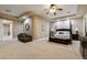 Spacious primary bedroom featuring trey ceilings, neutral carpet and a four poster bed at 2837 Turtle Head Peak Dr, Las Vegas, NV 89135