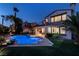 Backyard view showcasing a luxurious pool, patio, and outdoor kitchen area of the home at 2837 Turtle Head Peak Dr, Las Vegas, NV 89135