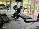 Well-equipped community gym with treadmills, stationary bikes, and large windows for a bright workout space at 3055 Key Largo Dr # 204, Las Vegas, NV 89120