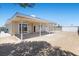 Wide angle of back of house, covered patio, and storage shed at 321 Oil Lantern Ln, Las Vegas, NV 89145