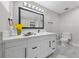 Updated bathroom with a white vanity, black hardware, and modern mirror at 321 Oil Lantern Ln, Las Vegas, NV 89145