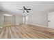 A light and airy bedroom with mirrored closet doors and wood-look floors at 321 Oil Lantern Ln, Las Vegas, NV 89145