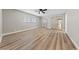 Open bedroom showcasing wood floors, mirrored closet doors, and ample natural light at 321 Oil Lantern Ln, Las Vegas, NV 89145