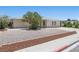 Updated single-story home with low maintenance landscaping and a brick retaining wall at 321 Oil Lantern Ln, Las Vegas, NV 89145