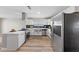 Modern kitchen featuring stainless steel appliances, white cabinets, and a stylish backsplash at 321 Oil Lantern Ln, Las Vegas, NV 89145