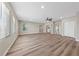 Large living room with hardwood floors, natural light, and closet space at 321 Oil Lantern Ln, Las Vegas, NV 89145