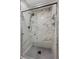 Elegant walk-in shower with marble-style tile and matte black fixtures at 321 Oil Lantern Ln, Las Vegas, NV 89145