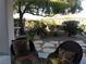 Outdoor seating area with comfortable cushioned chairs and flagstone walkway at 35 Emerald Dunes Cir, Henderson, NV 89052