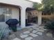 Outdoor covered patio with BBQ and lounge area, set against the backdrop of a desert landscape at 35 Emerald Dunes Cir, Henderson, NV 89052