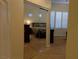 View of bedroom from hallway featuring closet and comfortable king bed at 35 Emerald Dunes Cir, Henderson, NV 89052