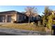 Charming single-story home with a two-car garage, well-manicured lawn, and desert landscaping at 35 Emerald Dunes Cir, Henderson, NV 89052