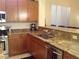 Spacious kitchen featuring granite countertops, stainless steel appliances, and ample cabinetry for storage at 35 Emerald Dunes Cir, Henderson, NV 89052