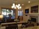 Bright dining area with views of the living room and backyard through large sliding glass doors at 35 Emerald Dunes Cir, Henderson, NV 89052