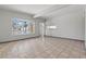 Spacious living room featuring bright window and neutral tile flooring at 3684 Hawaii Ave, Las Vegas, NV 89104