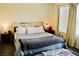 Comfortable bedroom featuring a queen bed, soft gray carpet, and sunny natural light at 3763 Sonrisa Vista Ave, Henderson, NV 89044