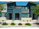 Inviting townhome featuring contemporary design and landscaping, with vibrant accents and a welcoming entrance at 3763 Sonrisa Vista Ave, Henderson, NV 89044