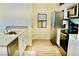 Well-lit kitchen with stainless steel appliances and modern white cabinets at 3763 Sonrisa Vista Ave, Henderson, NV 89044