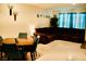 Welcoming living area with a modern dining set, a large sectional sofa, and tasteful decor at 3763 Sonrisa Vista Ave, Henderson, NV 89044