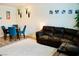 Comfortable living area featuring a plush sectional, modern decor, and a cozy atmosphere for relaxation at 3763 Sonrisa Vista Ave, Henderson, NV 89044