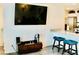 Living area with eat-in kitchen, TV, and modern furnishings at 3763 Sonrisa Vista Ave, Henderson, NV 89044