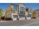 Well-maintained stucco building with individual garages in a desirable neighborhood with manicured landscaping at 3936 Pepper Thorn Ave # 3, North Las Vegas, NV 89081