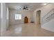 Bright living room features tile flooring, a window, and white-painted walls at 3936 Pepper Thorn Ave # 3, North Las Vegas, NV 89081