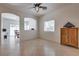 Open living area with tile floors and window with backyard views at 3936 Pepper Thorn Ave # 3, North Las Vegas, NV 89081