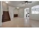 Bright living room with tile floors, staircase, and open layout, perfect for modern living at 3936 Pepper Thorn Ave # 3, North Las Vegas, NV 89081