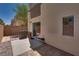 Cozy backyard patio area with brick wall and landscaping, perfect for relaxing and entertaining outdoors at 3936 Pepper Thorn Ave # 3, North Las Vegas, NV 89081