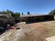 Large backyard with a covered patio, offering plenty of room for outdoor enjoyment and gatherings at 4503 Springdale Ave, Las Vegas, NV 89121