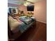 Cozy bedroom with a ceiling fan and a large bed set at 4503 Springdale Ave, Las Vegas, NV 89121