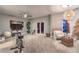 Spacious bonus room features a ceiling fan, seating area, and workout equipment at 47 Strada Principale, Henderson, NV 89011