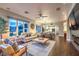 Bright, open-concept living room with a large window and stylish furnishings at 47 Strada Principale, Henderson, NV 89011