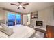 Beautiful main bedroom with fireplace, ceiling fan, balcony with mountain views at 47 Strada Principale, Henderson, NV 89011