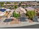 An aerial view of a charming single-story home with mature trees and a spacious driveway at 5115 Morning Splash Ave, Las Vegas, NV 89131