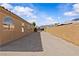 Large backyard of this property featuring a brick privacy wall, and lots of parking for RV or boats at 5115 Morning Splash Ave, Las Vegas, NV 89131